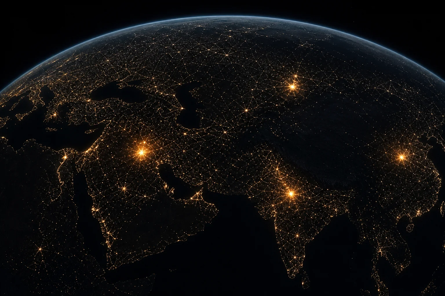 Earth from orbit at night: a dense web of compute lights across every continent, with only a few blazing points of concentrated GPU power